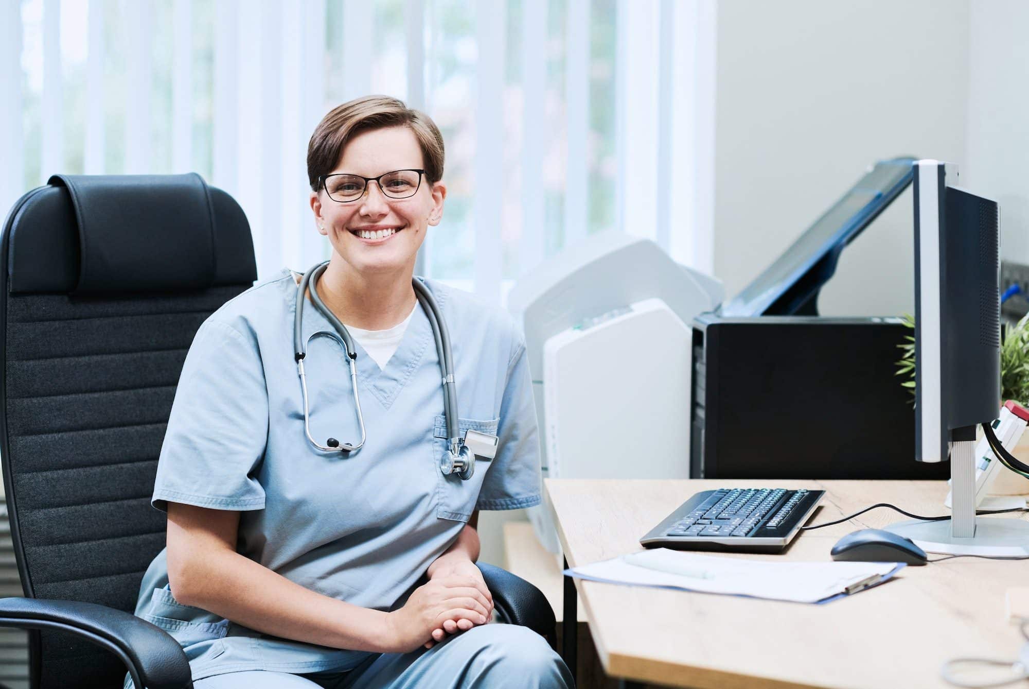 Portrait of happy doctor in office