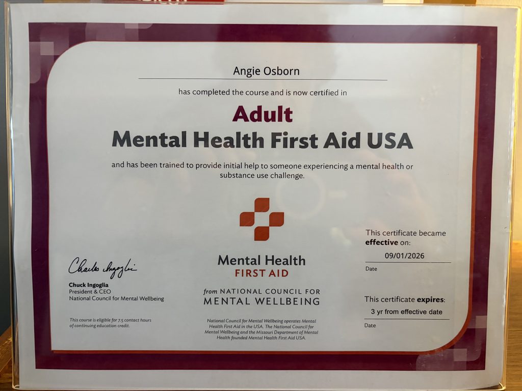 A photograph of Angie's Mental Health First Aid certificate, which will help Project Access West Tennessee better serve patients.